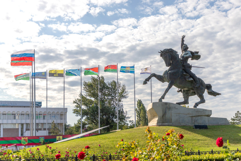 The Suvorov Monument and national flags in Tiraspol, reflecting Pridnestrovie Foreign Policy and state symbolism.